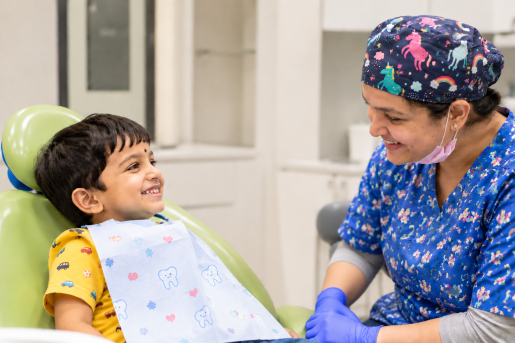 Pediatric dentist with a young patient